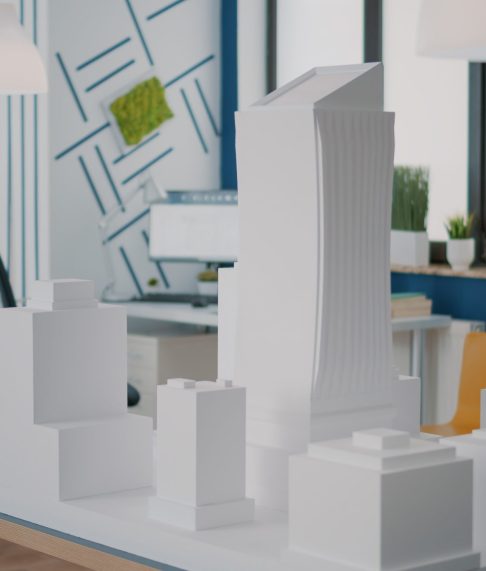 concept-building-model-construction-design-table-empty-workplace-maquette-urban-property-plan-used-real-estate-development-architectural-blueprints-structure-scaled.jpg